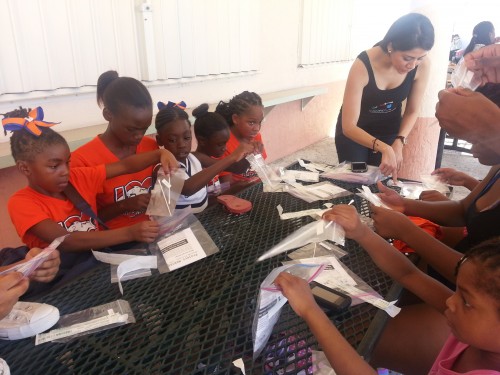 Mari (former Dolphins cheerleader) helps the Lauderhill, FL Broncos swab microbes!